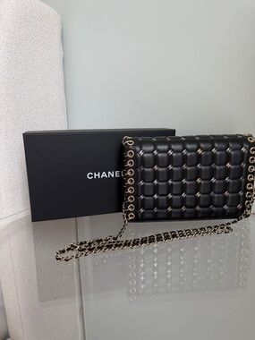 Chanel Lambskin Chocolate Bar Piercing CC Studded Small Chain Flap Bag in black.